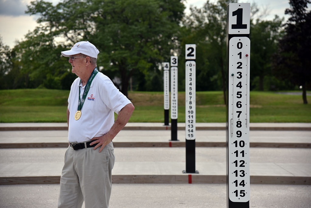 Bob Stephens watches over a game of bocce at the new bocce ball courts